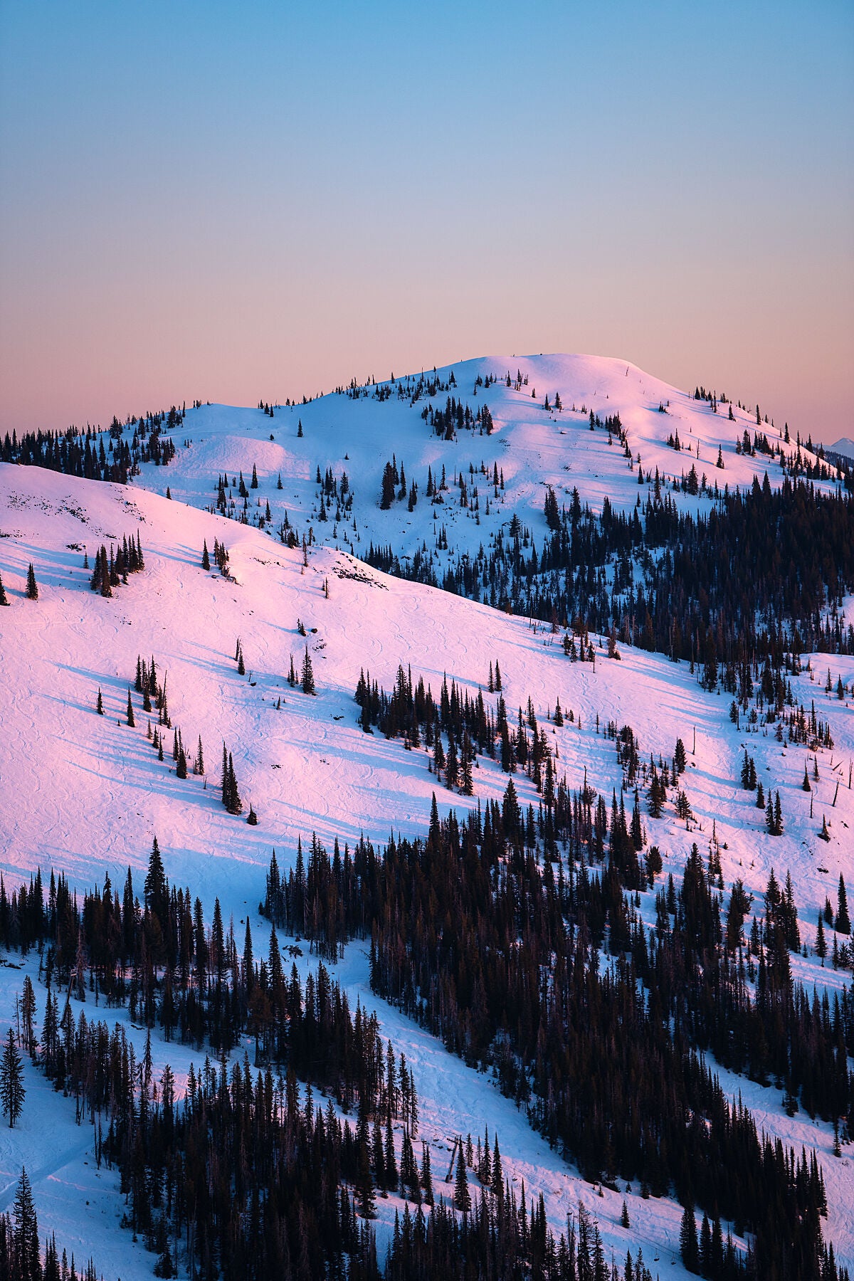 Sunrise light on Mount Kirkup, in the Rossland Range of British Columbia, captured by photographer Ashley Voykin in the West Kootenays