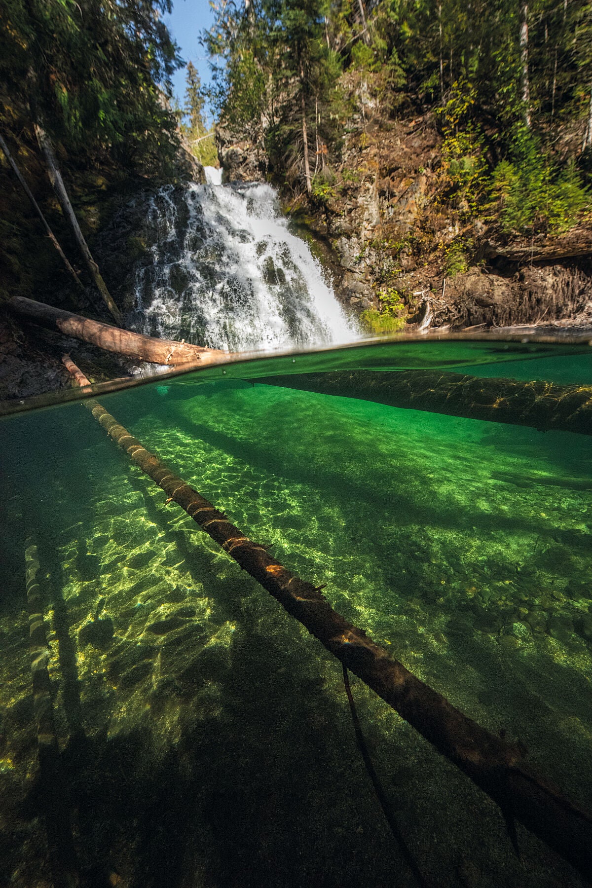 Underwater photograph of Deer Creek Falls near Deer Park, West of Castlegar, underwater fine art print by Ashley Voykin