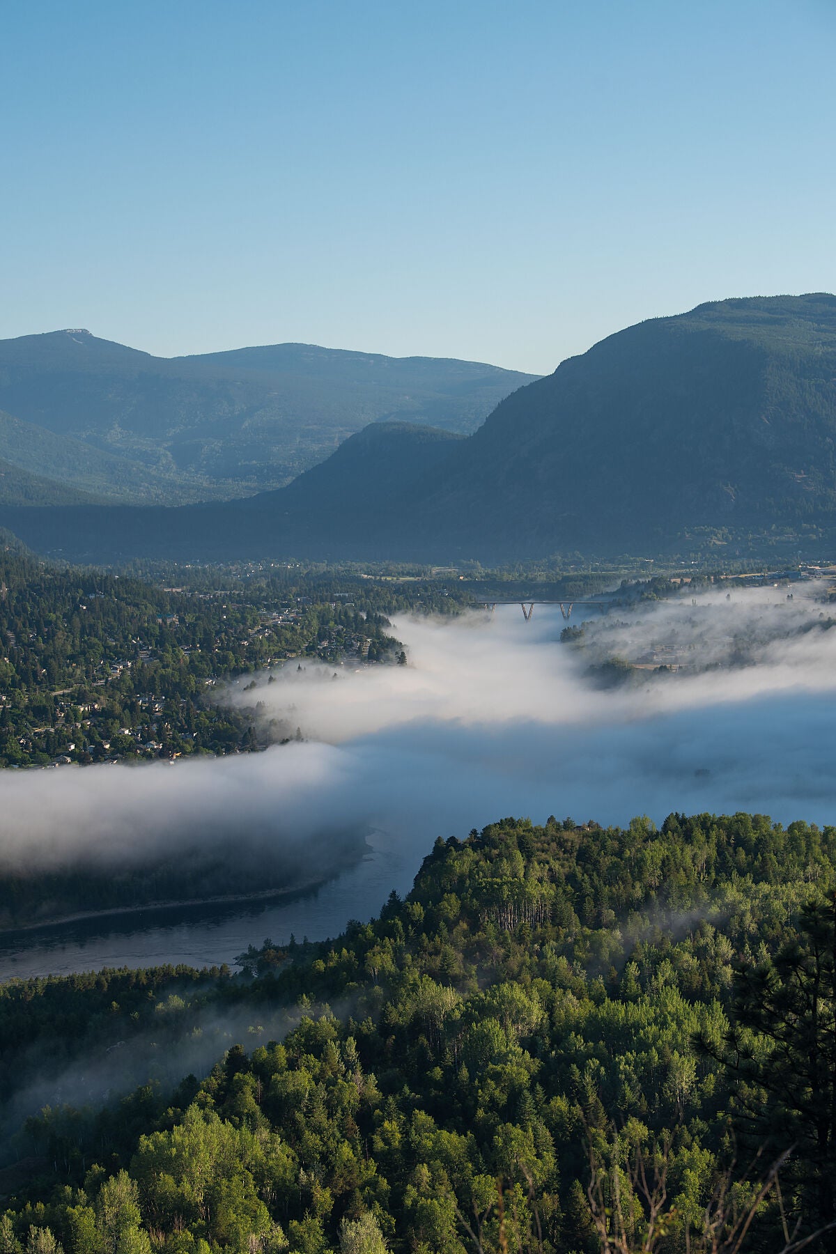 River fog from the Columbia River blankets parts of Castlegar, West Kootenay fine art print by Ashley Voykin