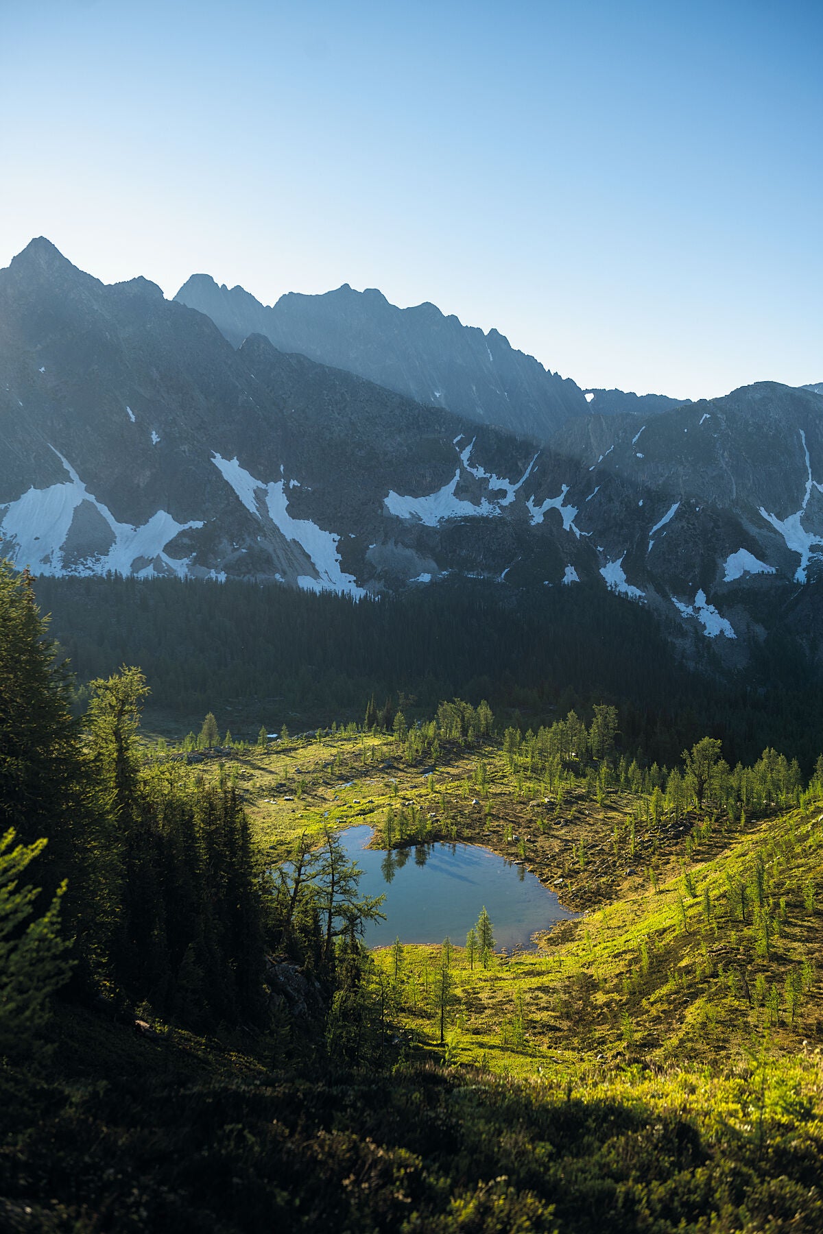 A scenic view of sunrise at Monica Meadows in the Purcell Mountains of British Columbia, Landscape photography by Ashley Voykin.