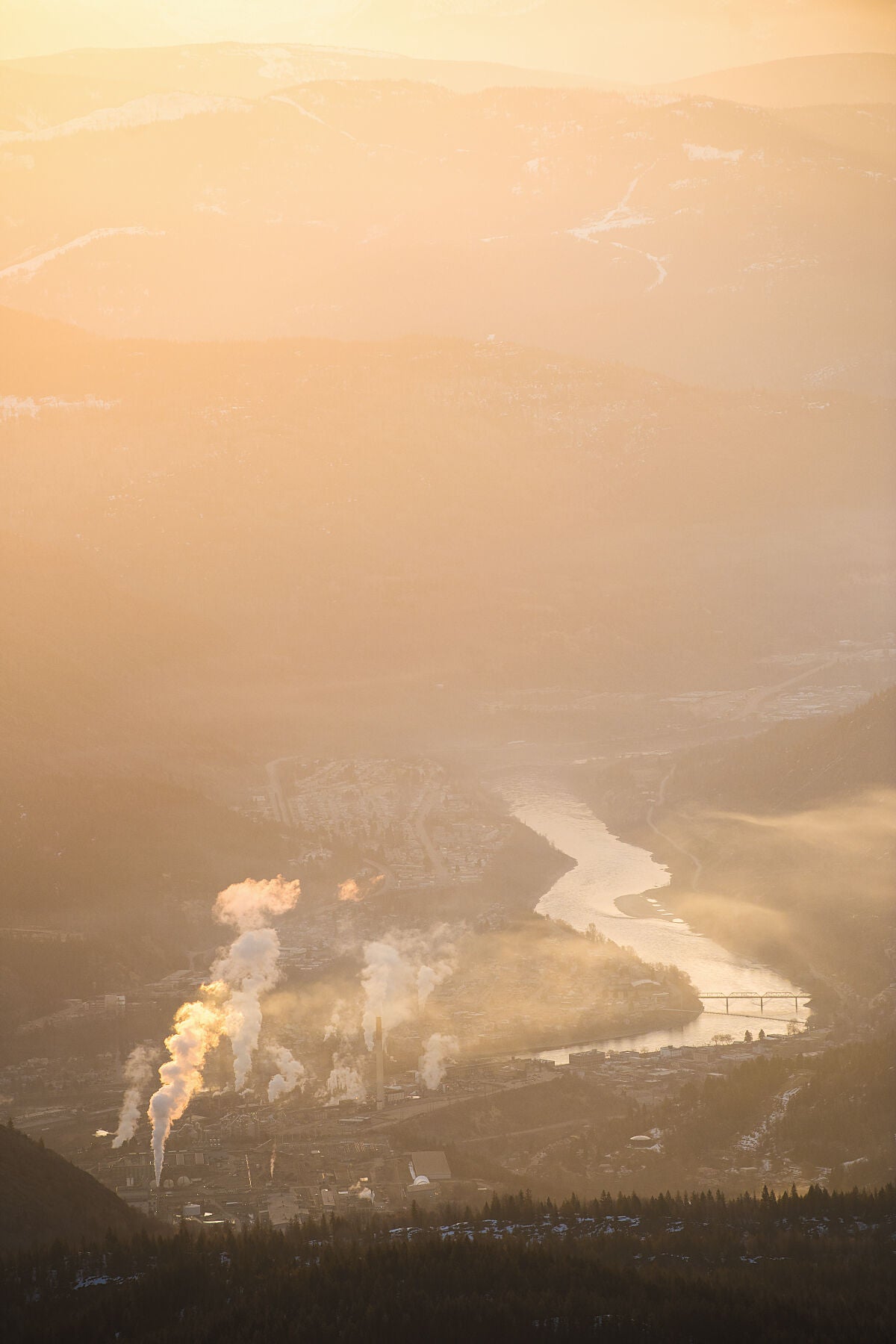 A sunrise during the winter over Trail and the Columbia River, captured by photographer Ashley Voykin in the West Kootenays