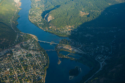 An aerial view of Castlegar, Robson, and the Columbia River in British Columbia, West Kootenay fine art photography by Ashley Voykin