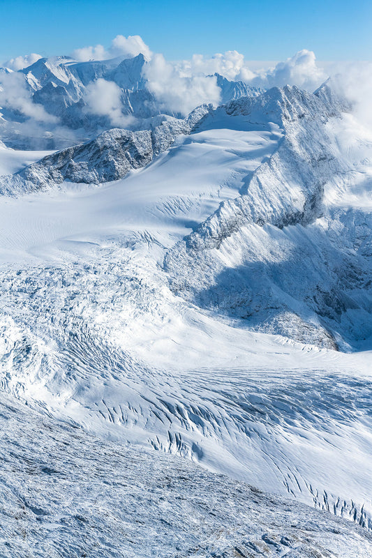 An aerial view of the Macbeth Icefield within the Purcell Mountains, British Columbia, showcasing snow-covered terrain and mountain peaks, fine art landscape print by Ashley Voykin