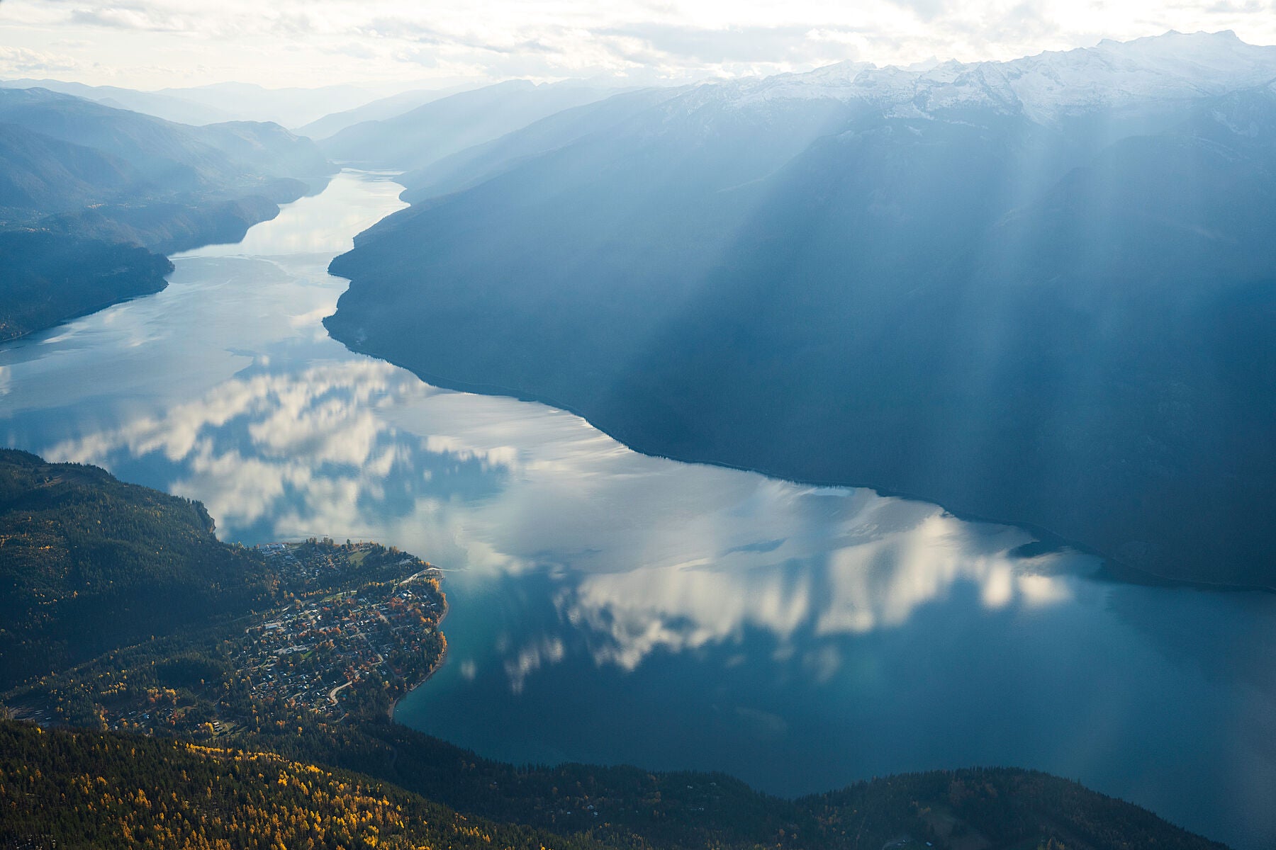 An aerial view of New Denver, Slocan Lake, and the Valhalla Range in British Columbia, Canada, fine art landscape print  by Ashley Voykin