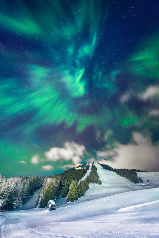 Northern Lights dancing above Red Mountain in the wintertime, Rossland BC. Fine art landscape photography by Ashley Voykin