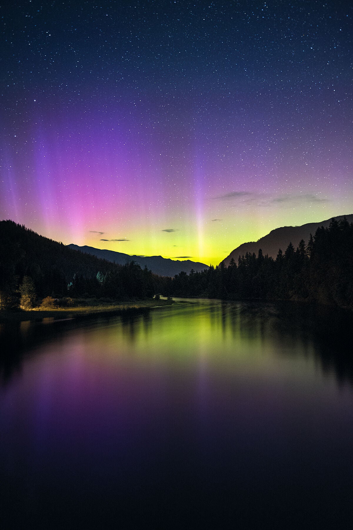 Aurora Borealis reflected onto the Slocan River, in Slocan City, West Kootenay fine art landscape photography by Ashley Voykin.