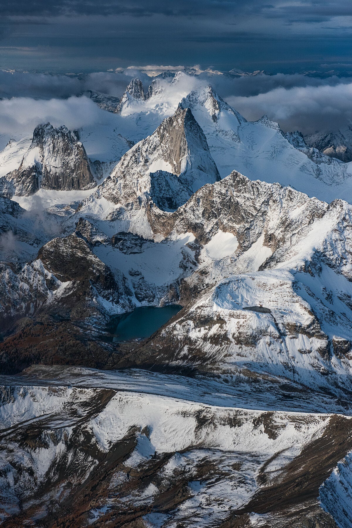 Fresh snow on the Bugaboo Mountain, a subrange of the Purcell Mountain Range in British Columbia, aerial landscape photography by Ashley Voykin.