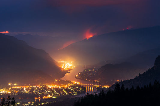 A nighttime view of the Syringa Creek Wildfire burning above Castlegar, in British Columbia's West Kootenay Region, Environment fine art landscape by Ashley Voykin