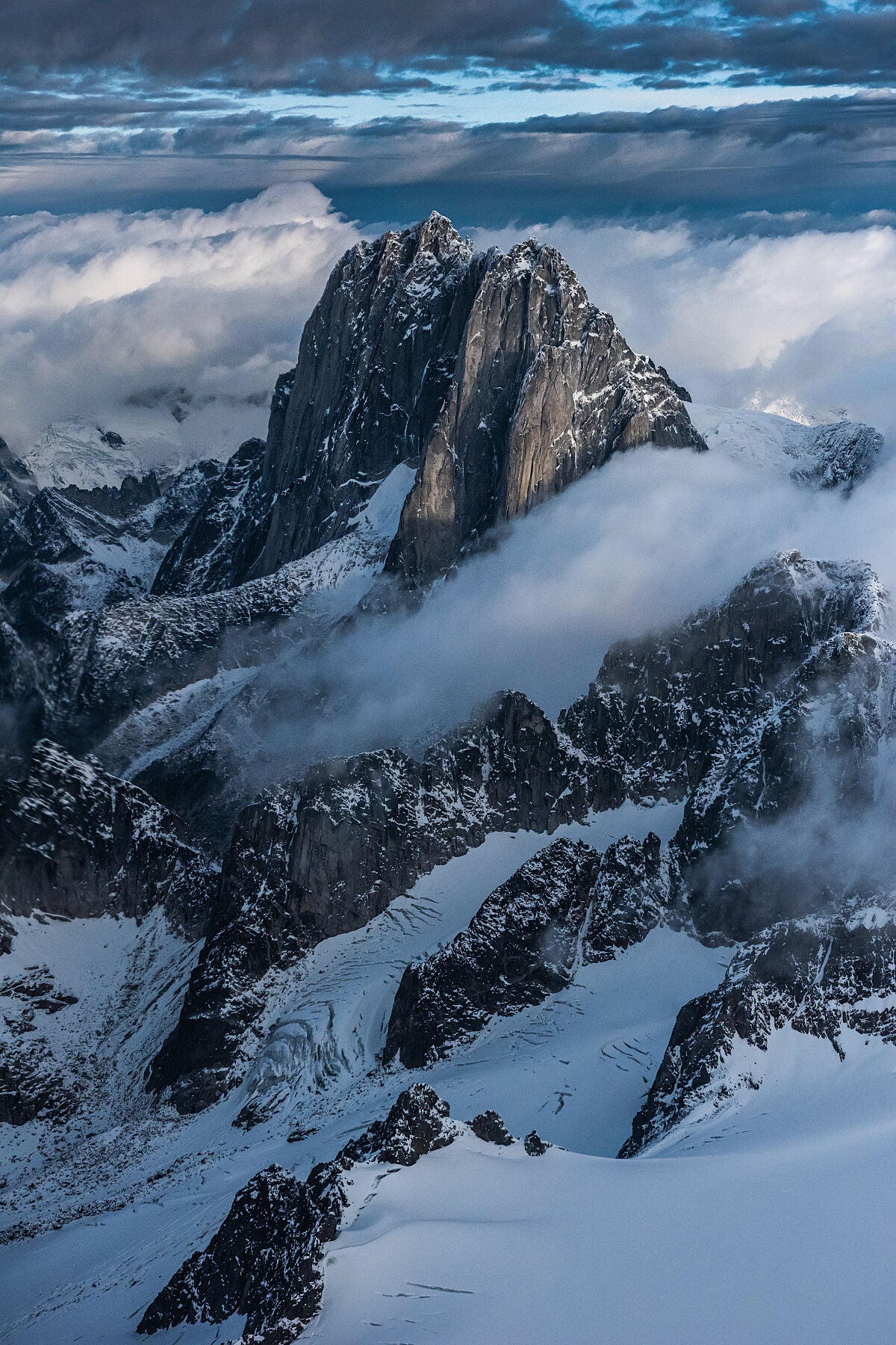 Howser Spire in the Bugaboo's on a cloudy fall day, captured by Kootenay photographer Ashley Voykin