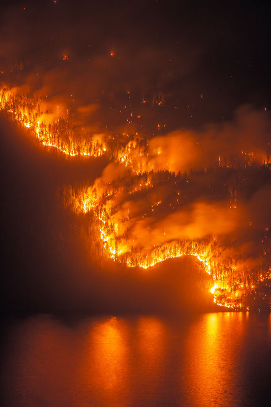 The Michaud Creek Wildfire burning across Lower Arrow Lake, West of Castlegar, British Columbia. Environmental landscape print by Ashley Voykin.