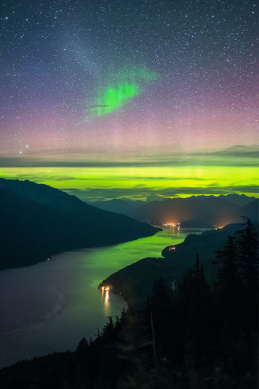 Aurora Borealis visible in the night sky above Slocan Lake, New Denver, and Silverton, West Kootenay landscape photography by Ashley Voykin.