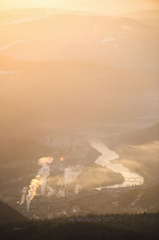 A sunrise during the winter over Trail and the Columbia River, captured by photographer Ashley Voykin in the West Kootenays
